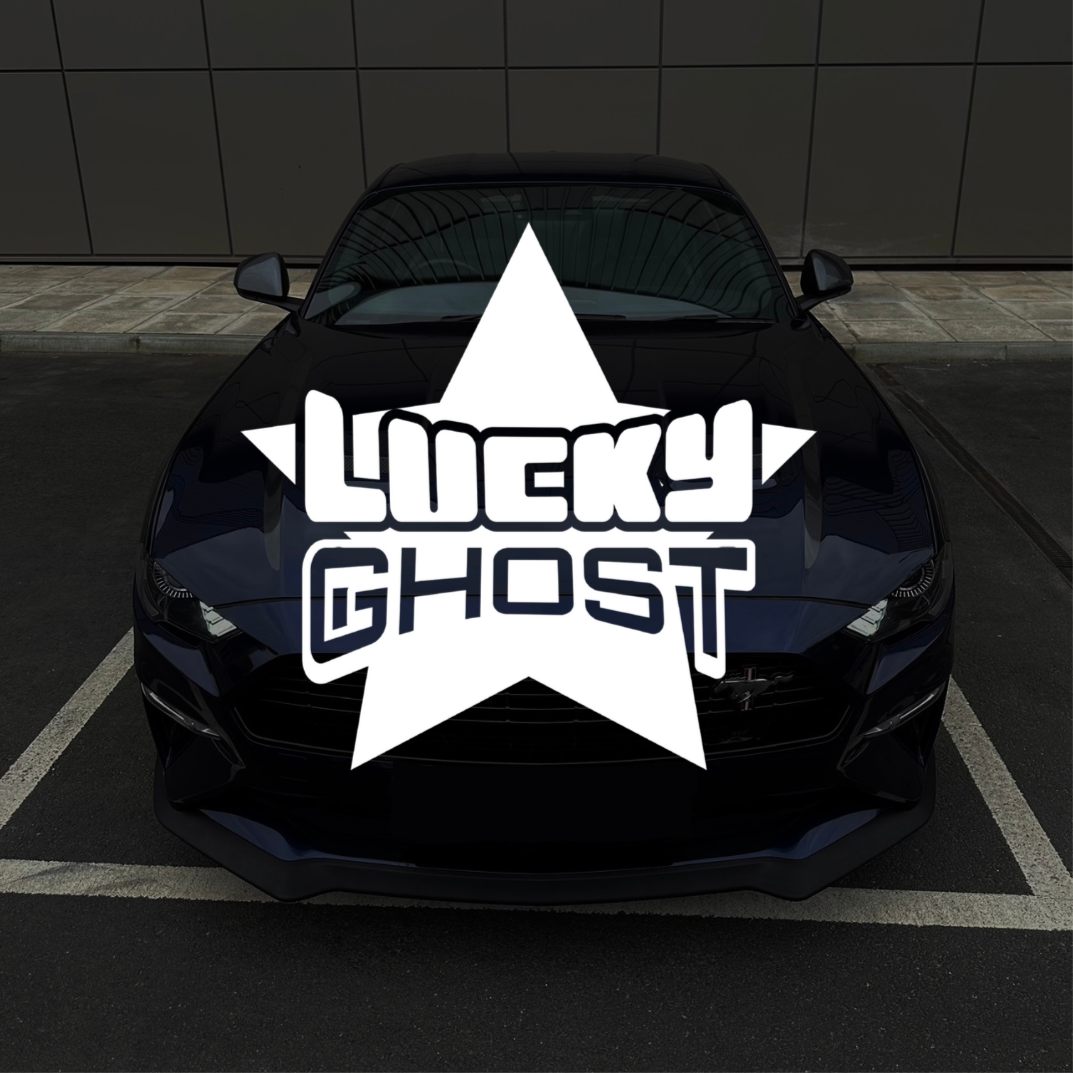 Black car with 'Lucky Ghost' logo on a dark background