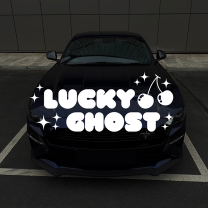 Car with 'Lucky Ghost' decal on a black background