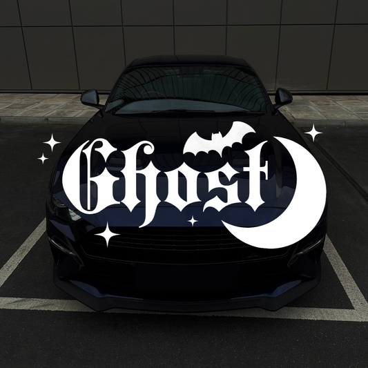 Black car with 'Ghost' logo on a dark tiled floor