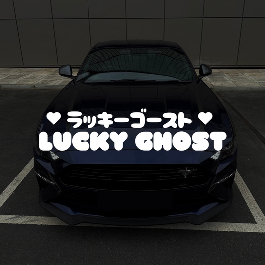 Black car with 'Lucky Ghost' text on a dark background