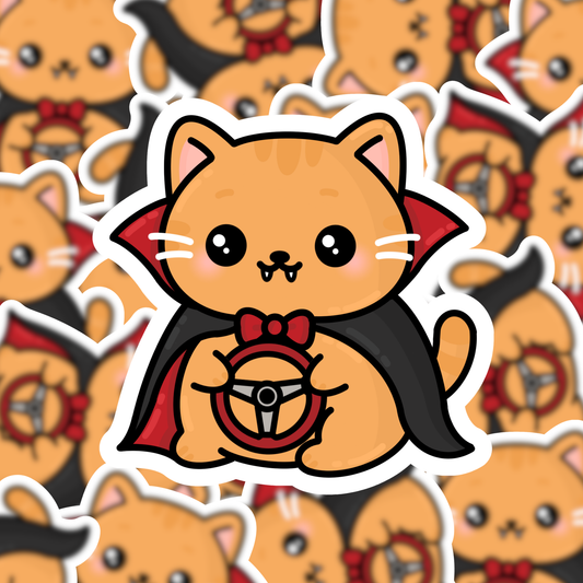 A die-cut sticker featuring a cute orange tabby cat dressed as a vampire, holding a steering wheel, with a black cape and red collar details, shown against a background of repeated versions of the same sticker.