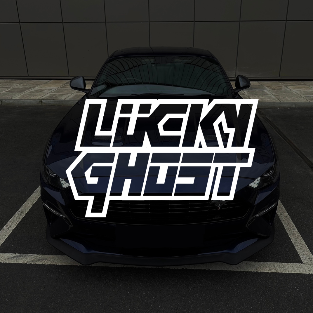 Black car with 'Lucky Ghost' logo on a dark background
