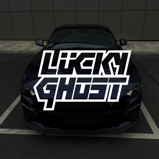 Black car with 'Lucky Ghost' logo on a dark background