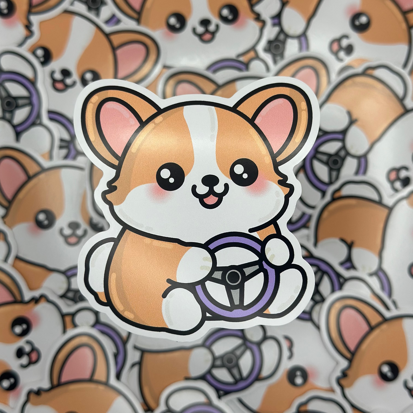 Sticker of a corgi with a steering wheel on a background of similar corgi illustrations.