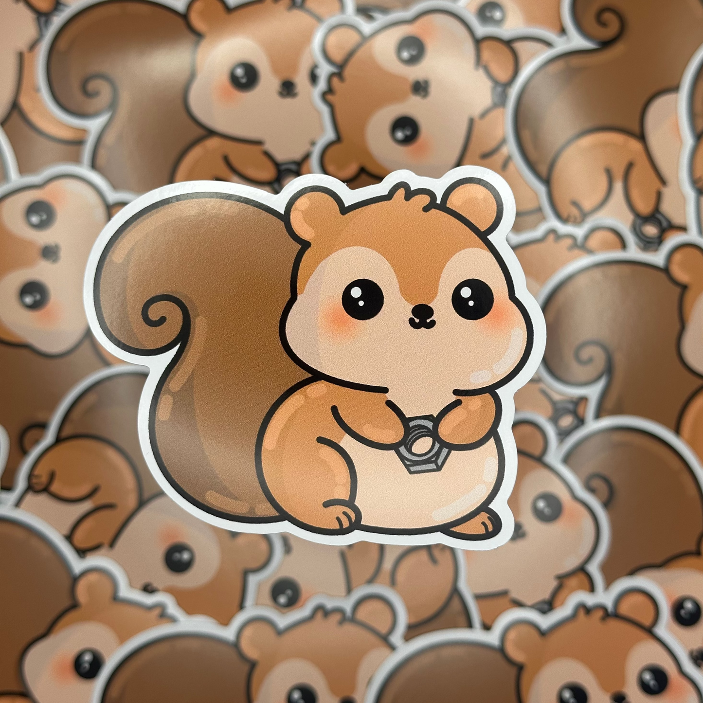 Cartoon squirrel sticker on a patterned background of cartoon squirrels.