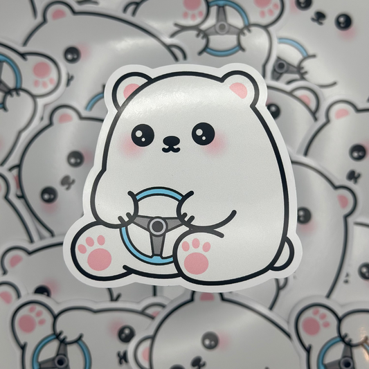 Sticker of a cute polar bear with a steering wheel on a patterned background