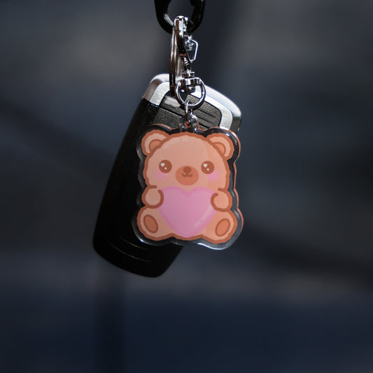 Keychain with a bear design on a dark background